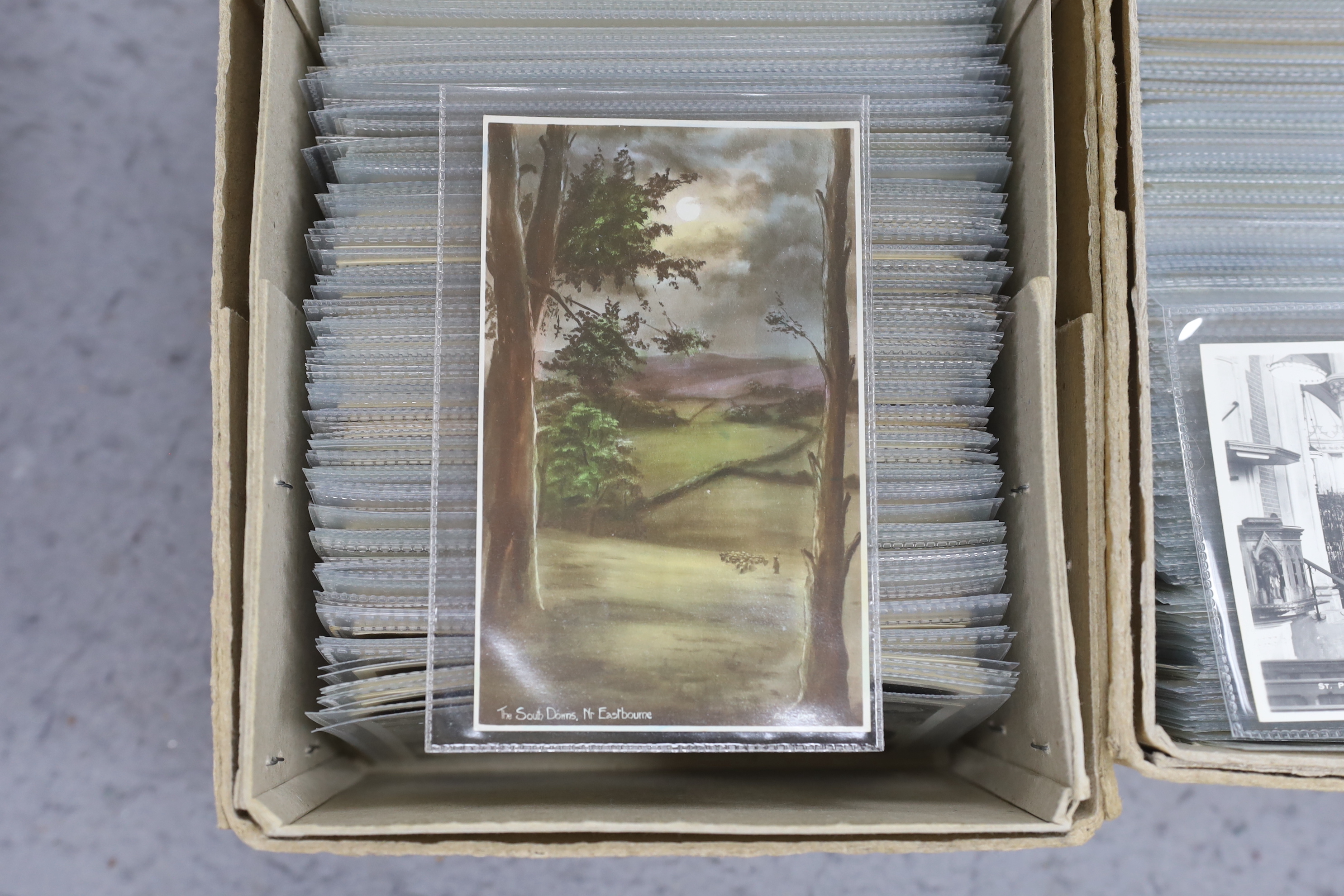 A large quantity of early to mid 20th century postcards of Eastbourne and the surrounding area, all in individual protective sleeves